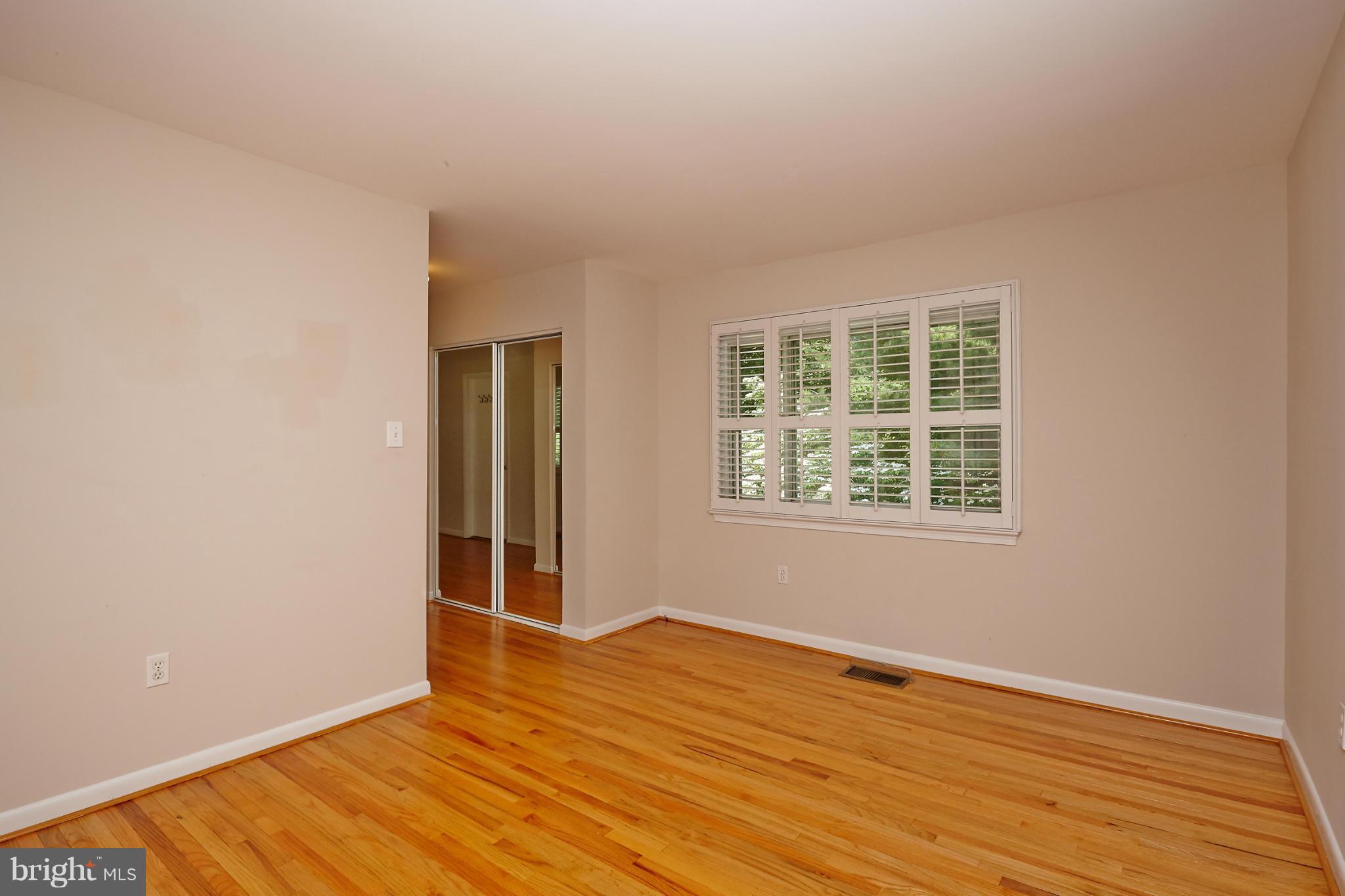 1426 Yellowwood Court Reston, VA 20190 - Photo 18 of 30 an empty room with wooden floor and windows