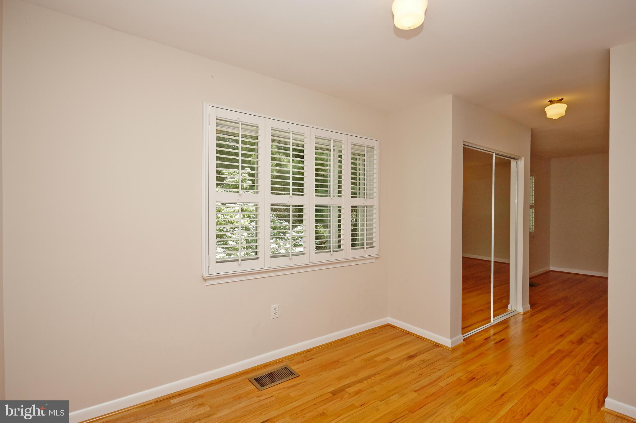 1426 Yellowwood Court Reston, VA 20190 - Photo 21 of 30 an empty room with wooden floor and windows