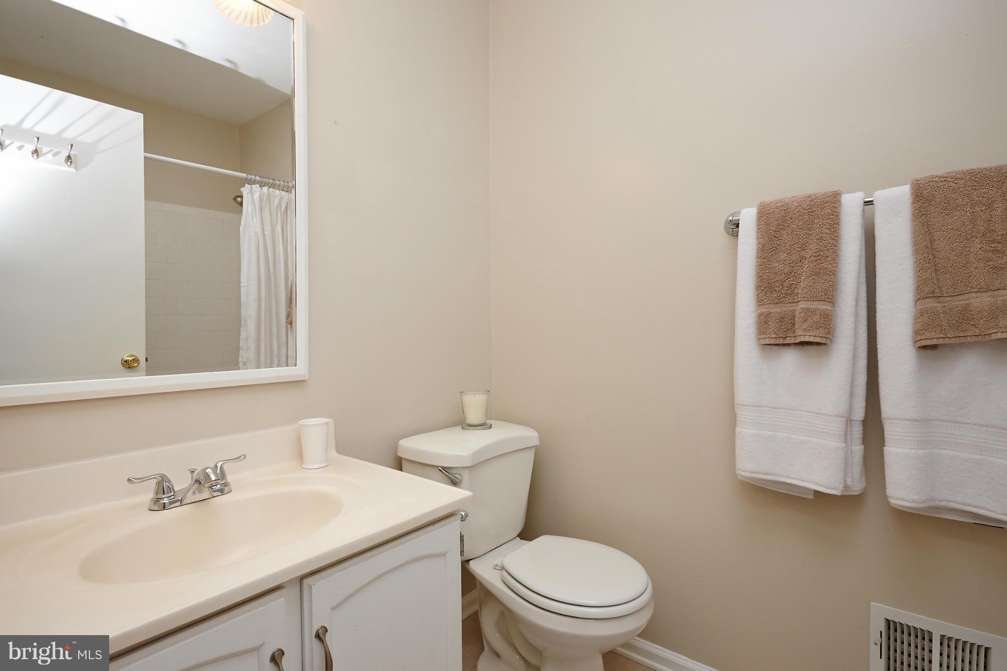1426 Yellowwood Court Reston, VA 20190 - Photo 22 of 30 a bathroom with a sink toilet and mirror