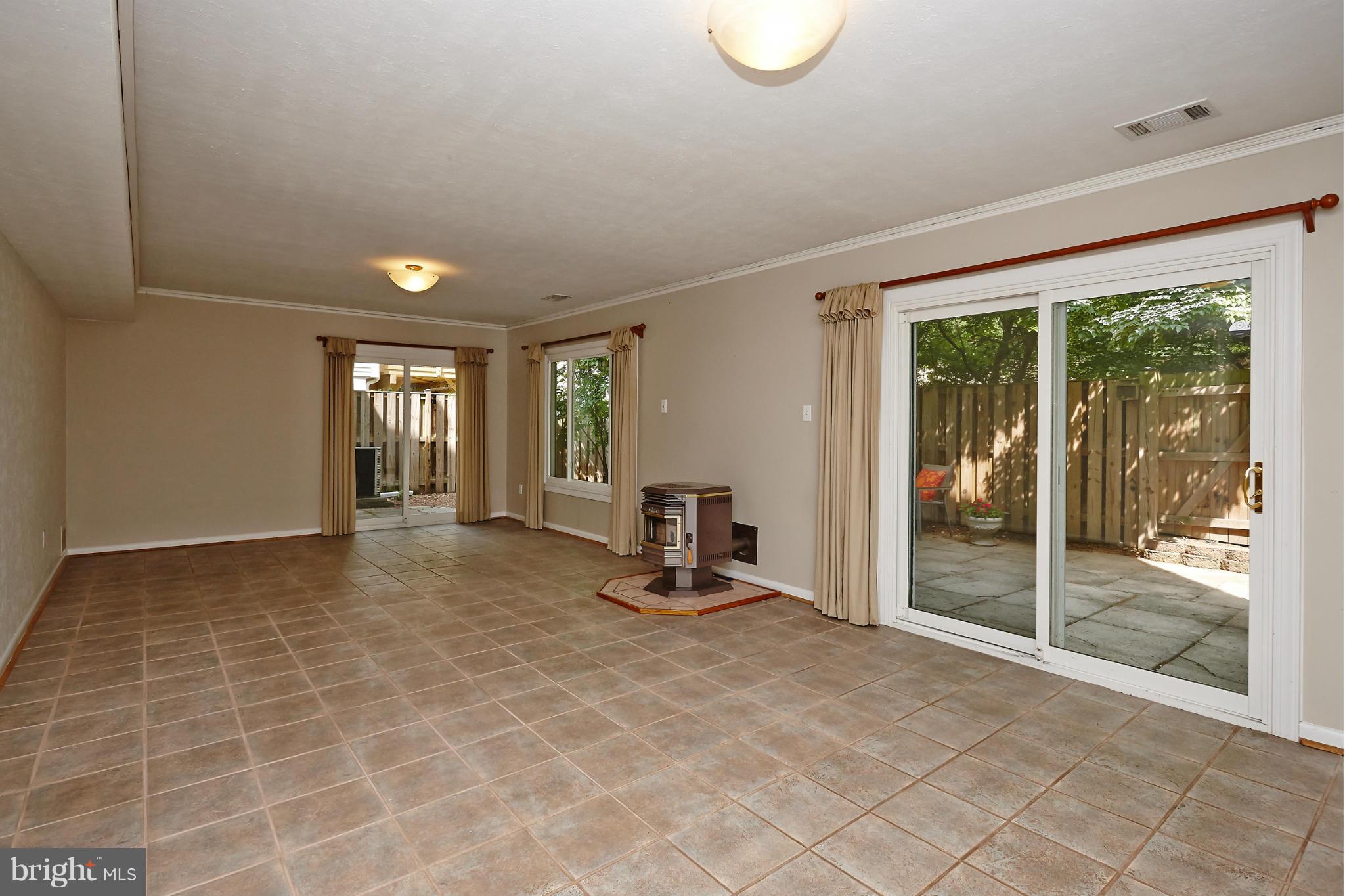 1426 Yellowwood Court Reston, VA 20190 - Photo 23 of 30 a view of a room with gym equipment and floor to ceiling window