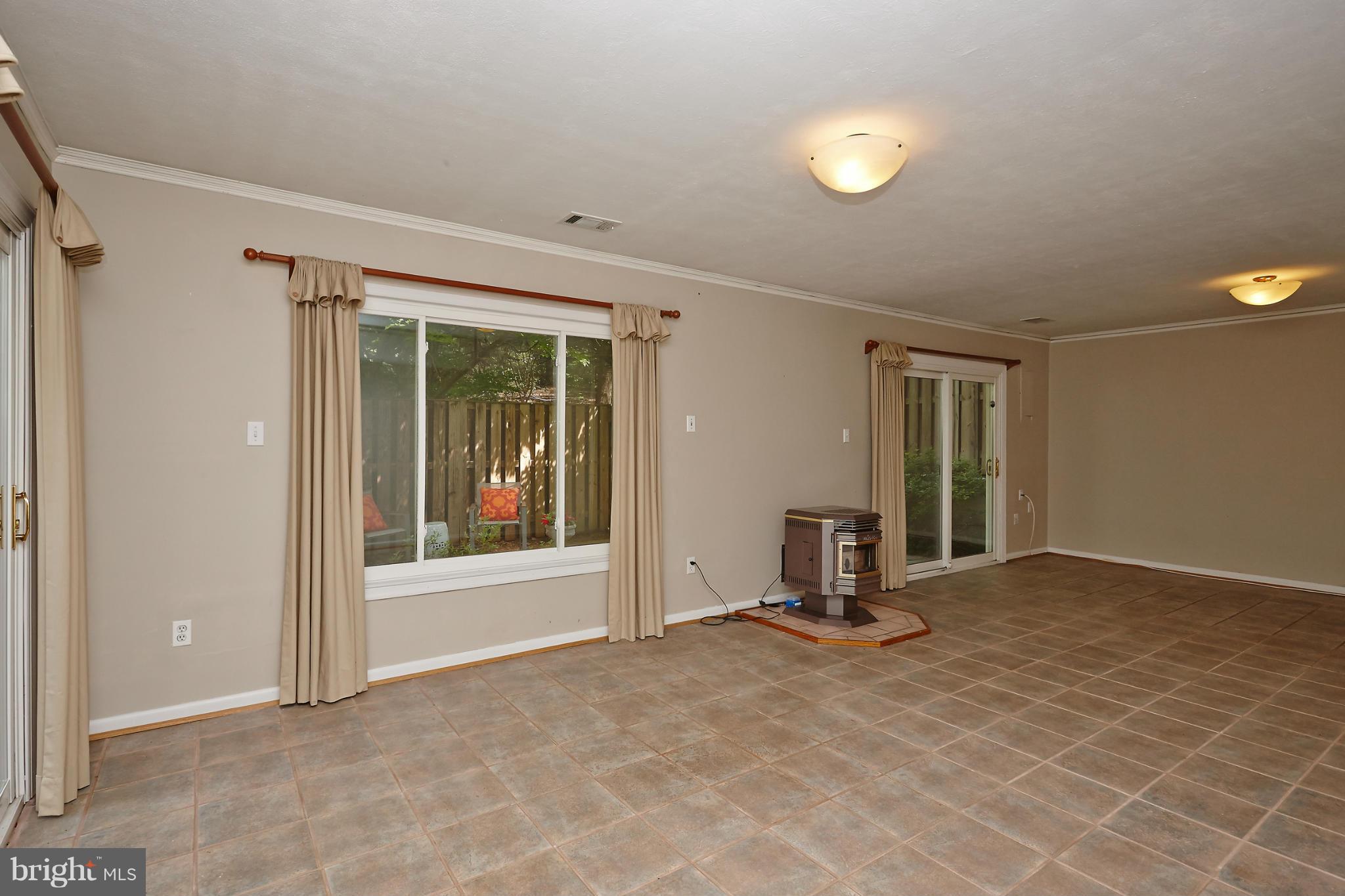 1426 Yellowwood Court Reston, VA 20190 - Photo 24 of 30 a view of an empty room with window and cabinet area