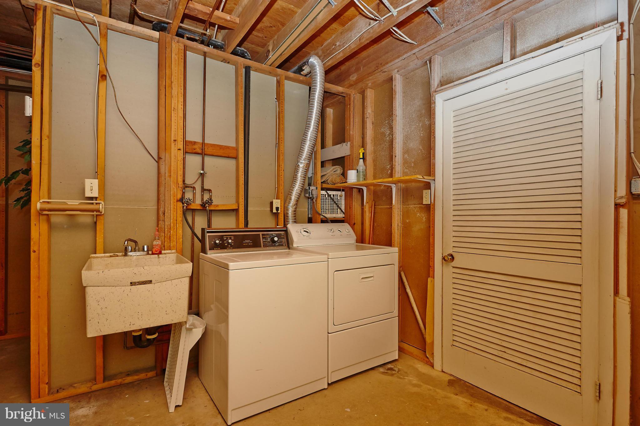 1426 Yellowwood Court Reston, VA 20190 - Photo 25 of 30 a view of a storage & utility room with washer and dryer