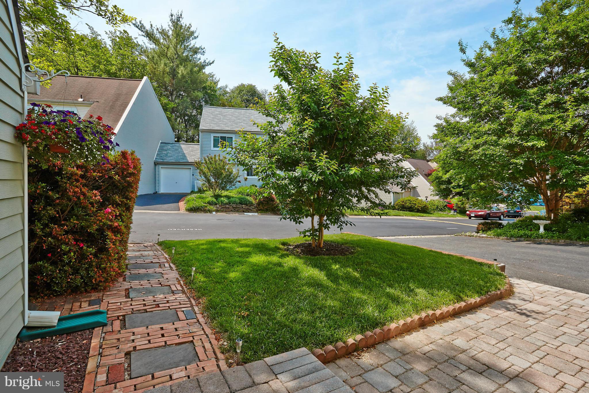 1426 Yellowwood Court Reston, VA 20190 - Photo 3 of 30 a front view of a house with garden