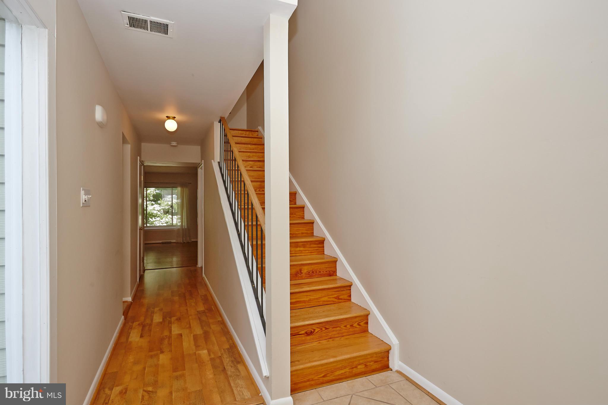 1426 Yellowwood Court Reston, VA 20190 - Photo 5 of 30 a view of a hallway with stairs