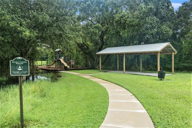a view of a house with a yard porch and sitting area