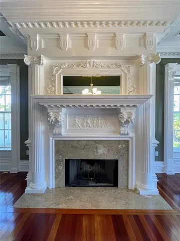 a view of a livingroom with hardwood floor and a ceiling fan