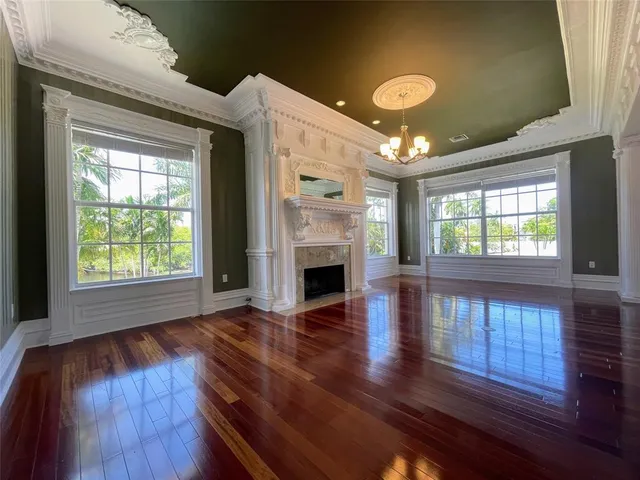 a kitchen with granite countertop a sink a counter top space stainless steel appliances and cabinets