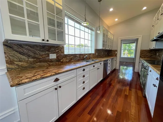a view of a door door with wooden floor