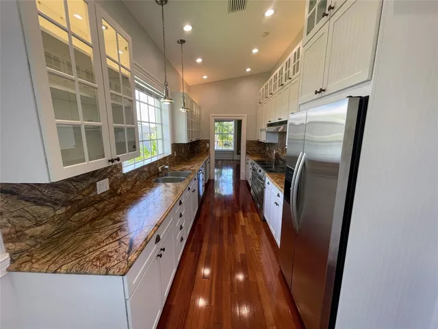a view of a door and wooden walls