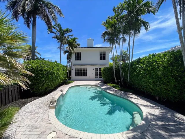 a view of a backyard with a patio