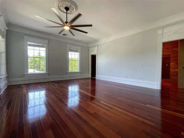 a bathroom with a toilet a sink and a large mirror
