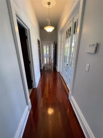 a view of an empty room and a window