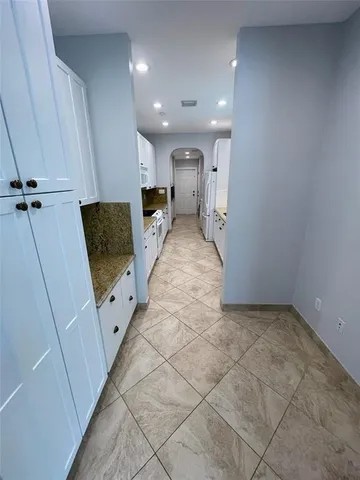 a view of backyard with swimming pool and outdoor seating