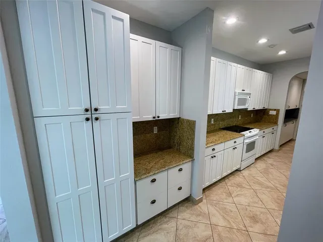 a view of a swimming pool with a garden