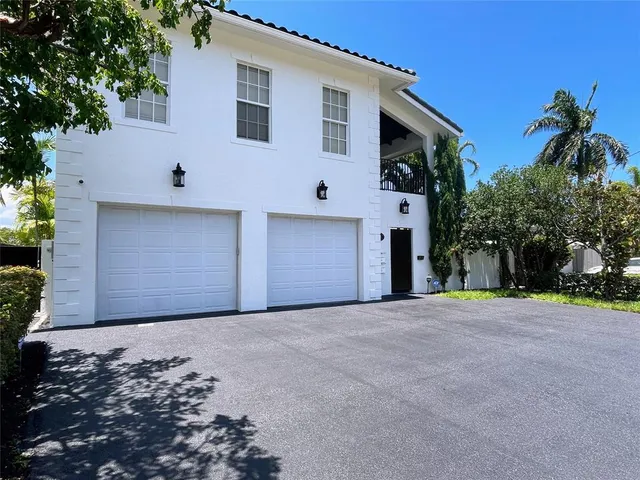a blue sign sitting on top of a wall
