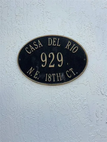 a view of a livingroom with wooden floor a fireplace and window