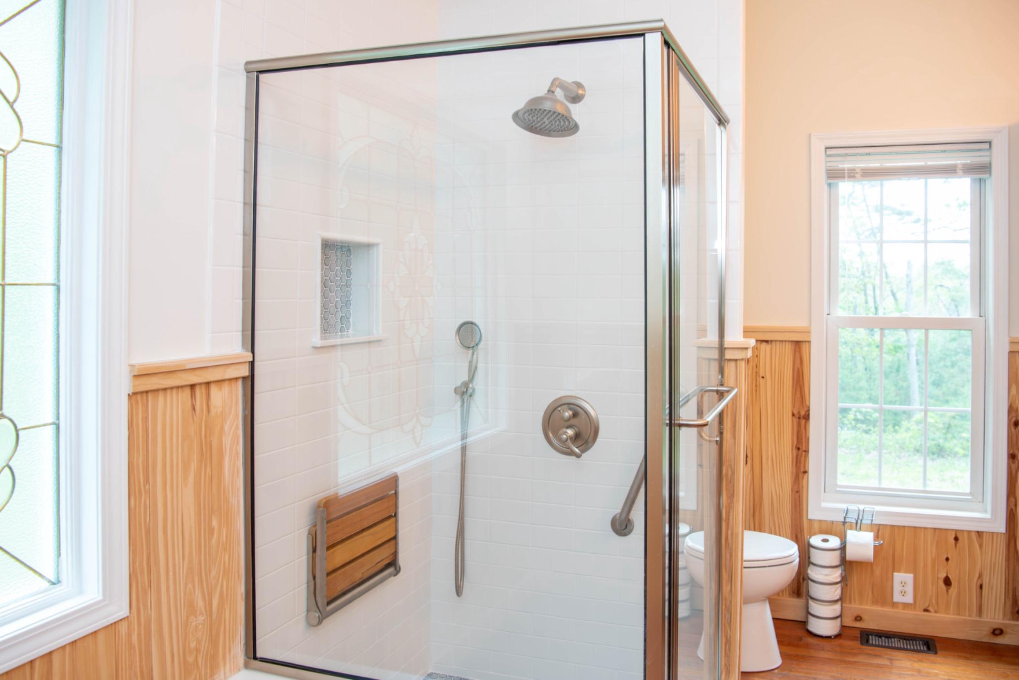 792 Forest Glen Road Moorefield, WV 26836 - Photo 64 of 146 Sleek walk-in shower w/natural light in ensuite.