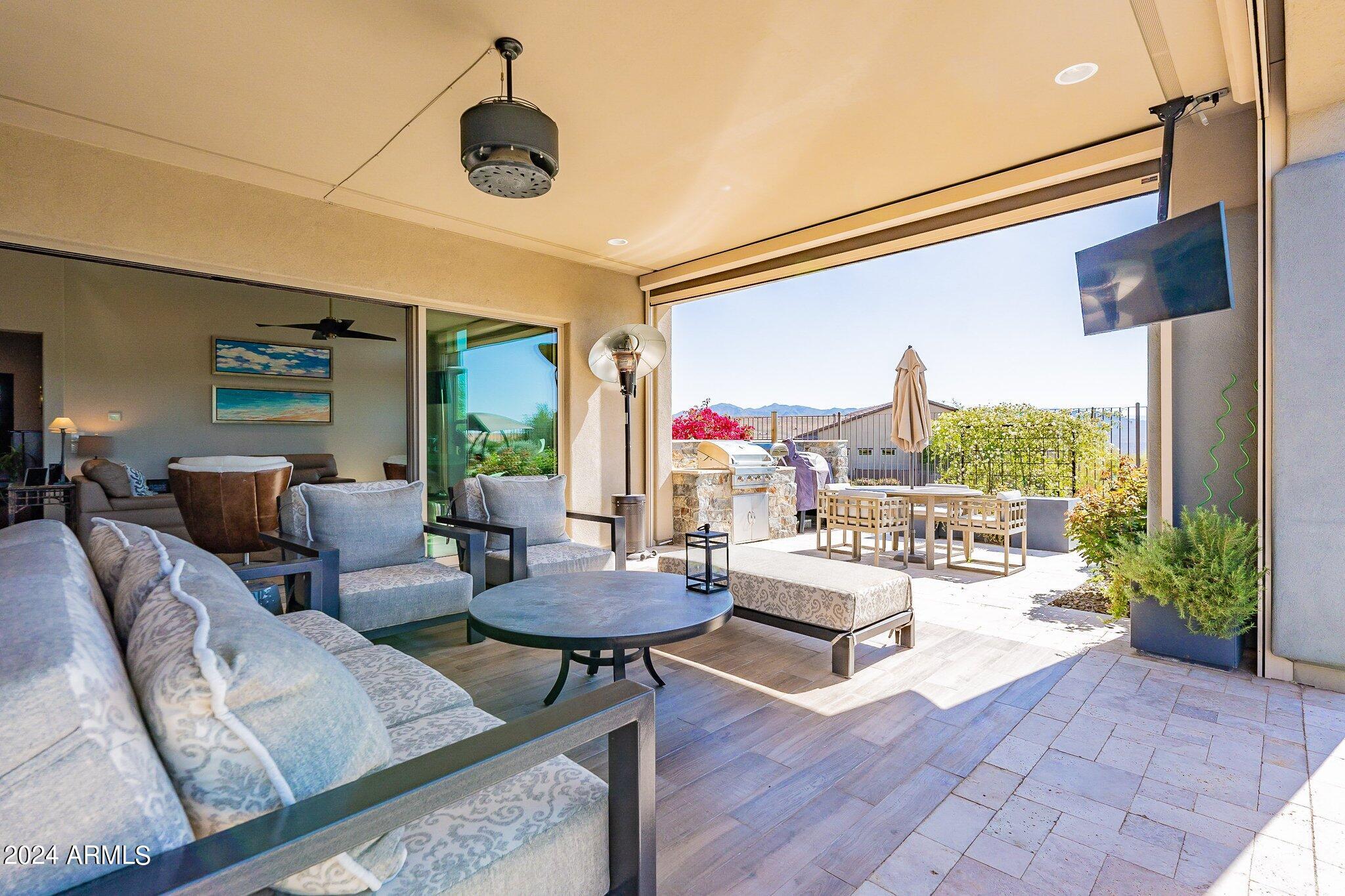 17795 East StockingTrail Rio Verde, AZ 85263 - Photo 41 of 52 Main patio, TV and out to dinning table