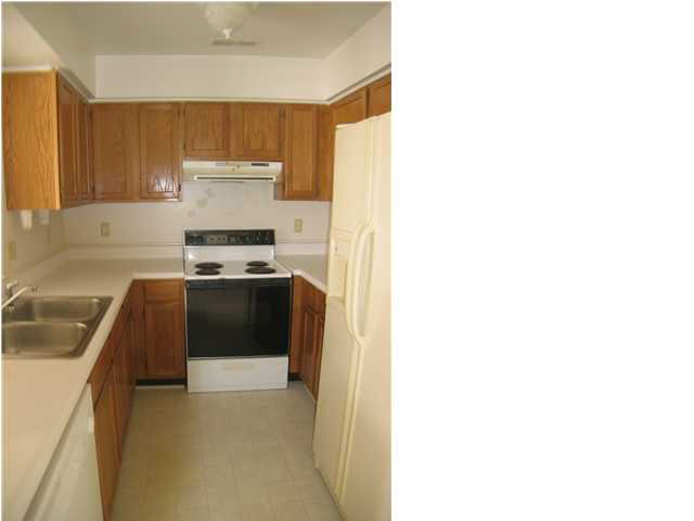 980 Tanglewood Road Charlottesville, VA 22901 - Photo 1 of 1 a kitchen with cabinets and a stove