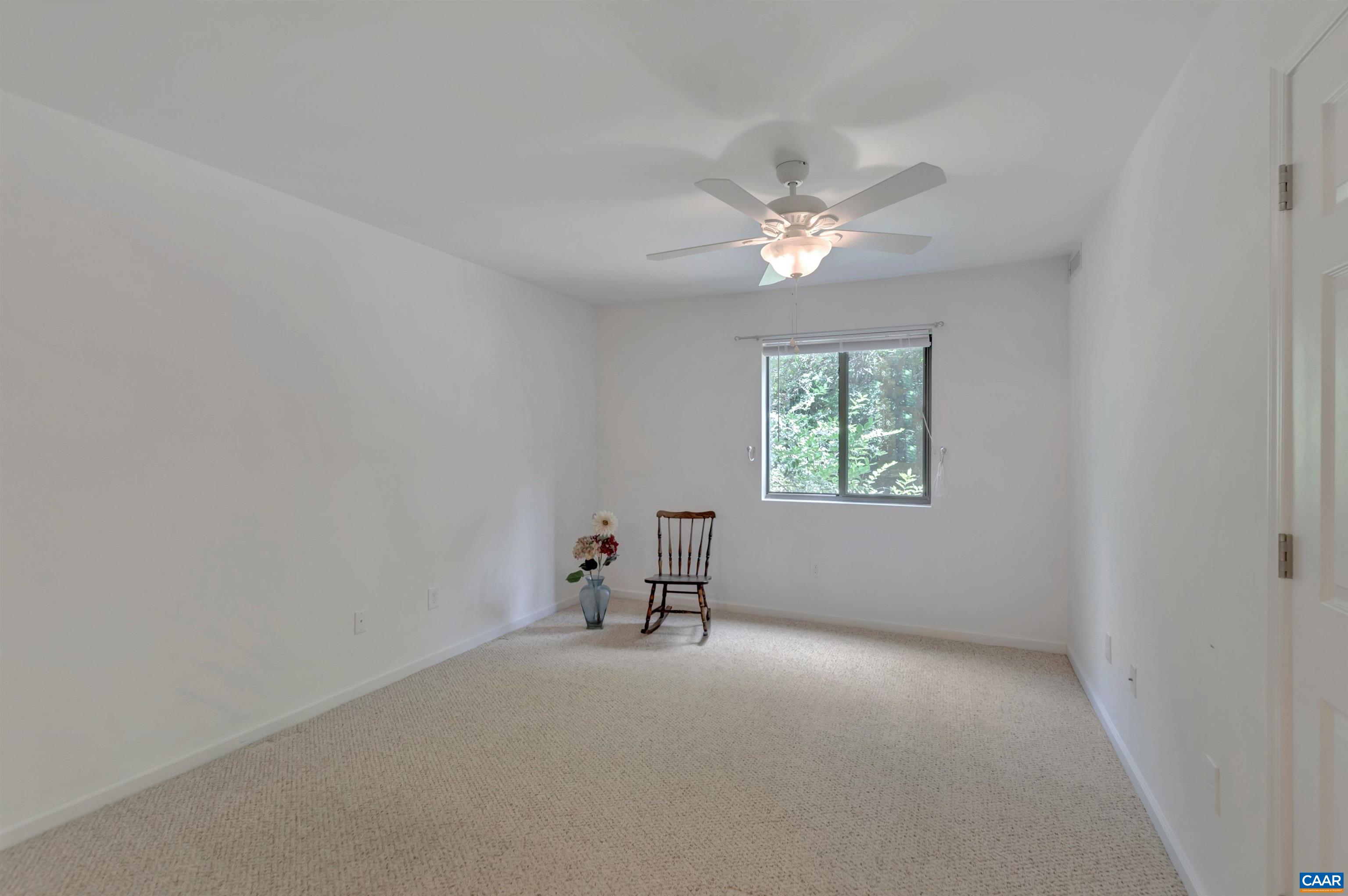 125 Turtle Creek Road, Unit 2 Charlottesville, VA 22901 - Photo 23 of 33 an empty room with a window and a fan