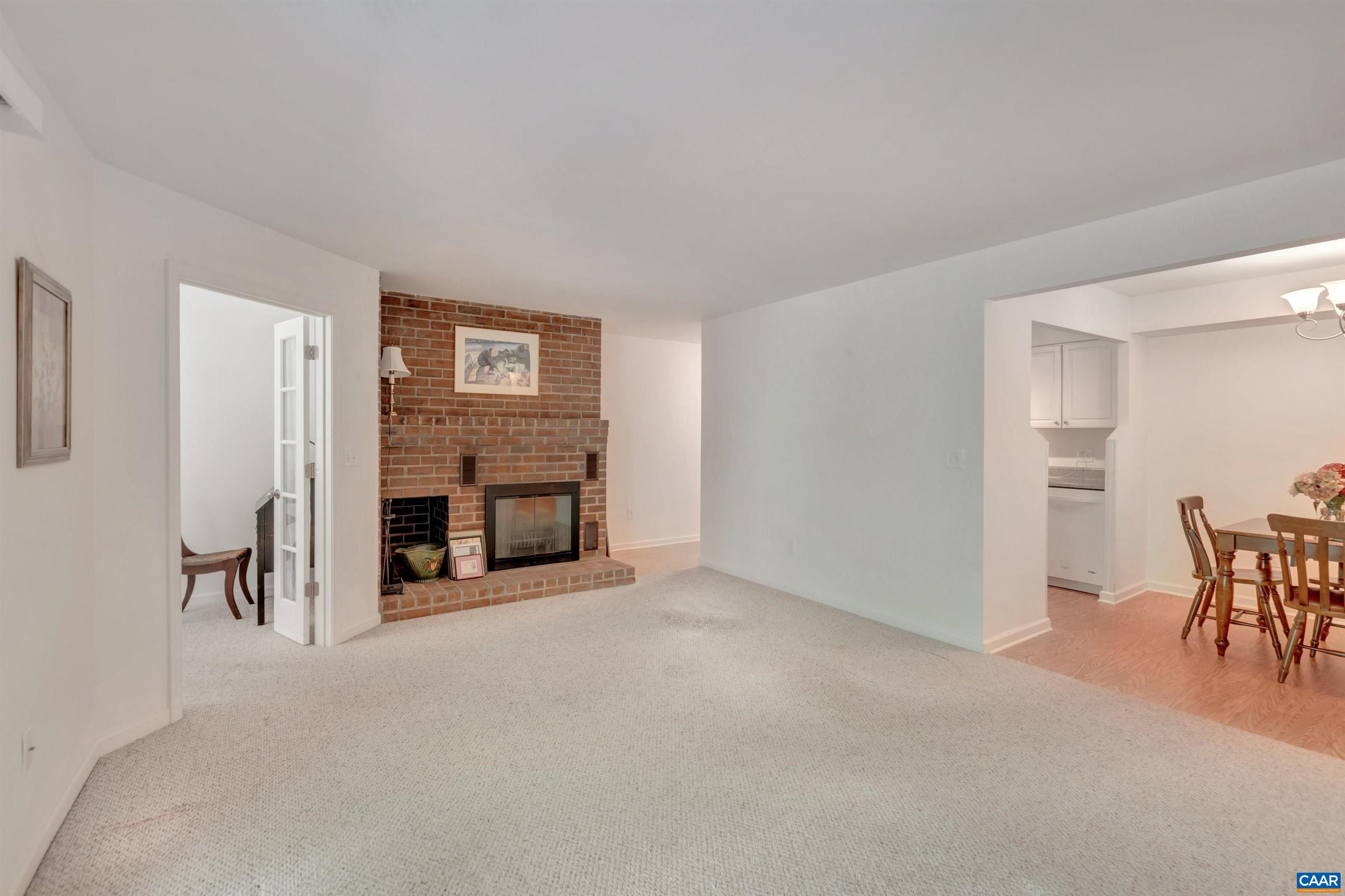 125 Turtle Creek Road, Unit 2 Charlottesville, VA 22901 - Photo 4 of 33 a view of a livingroom with a fireplace and furniture