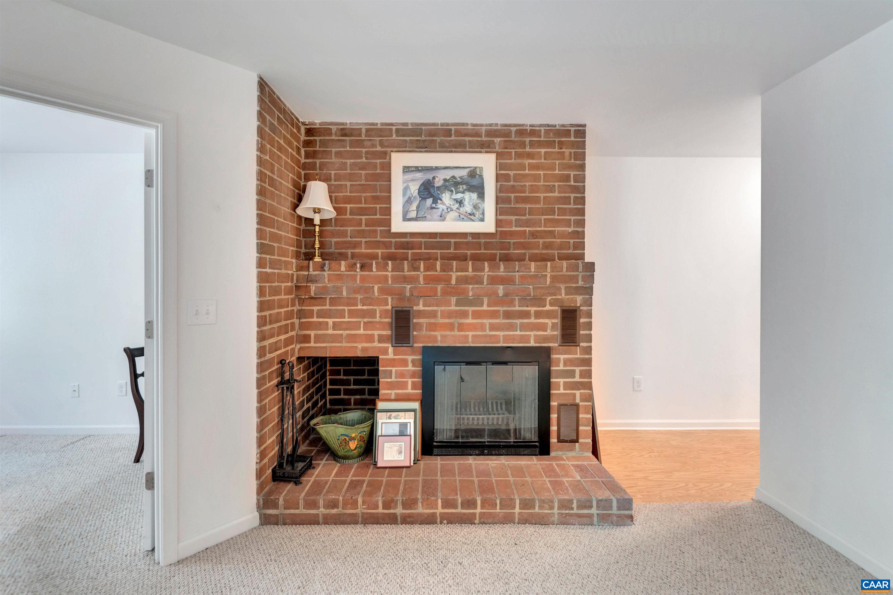 125 Turtle Creek Road, Unit 2 Charlottesville, VA 22901 - Photo 6 of 33 a view of a livingroom with a fireplace and window