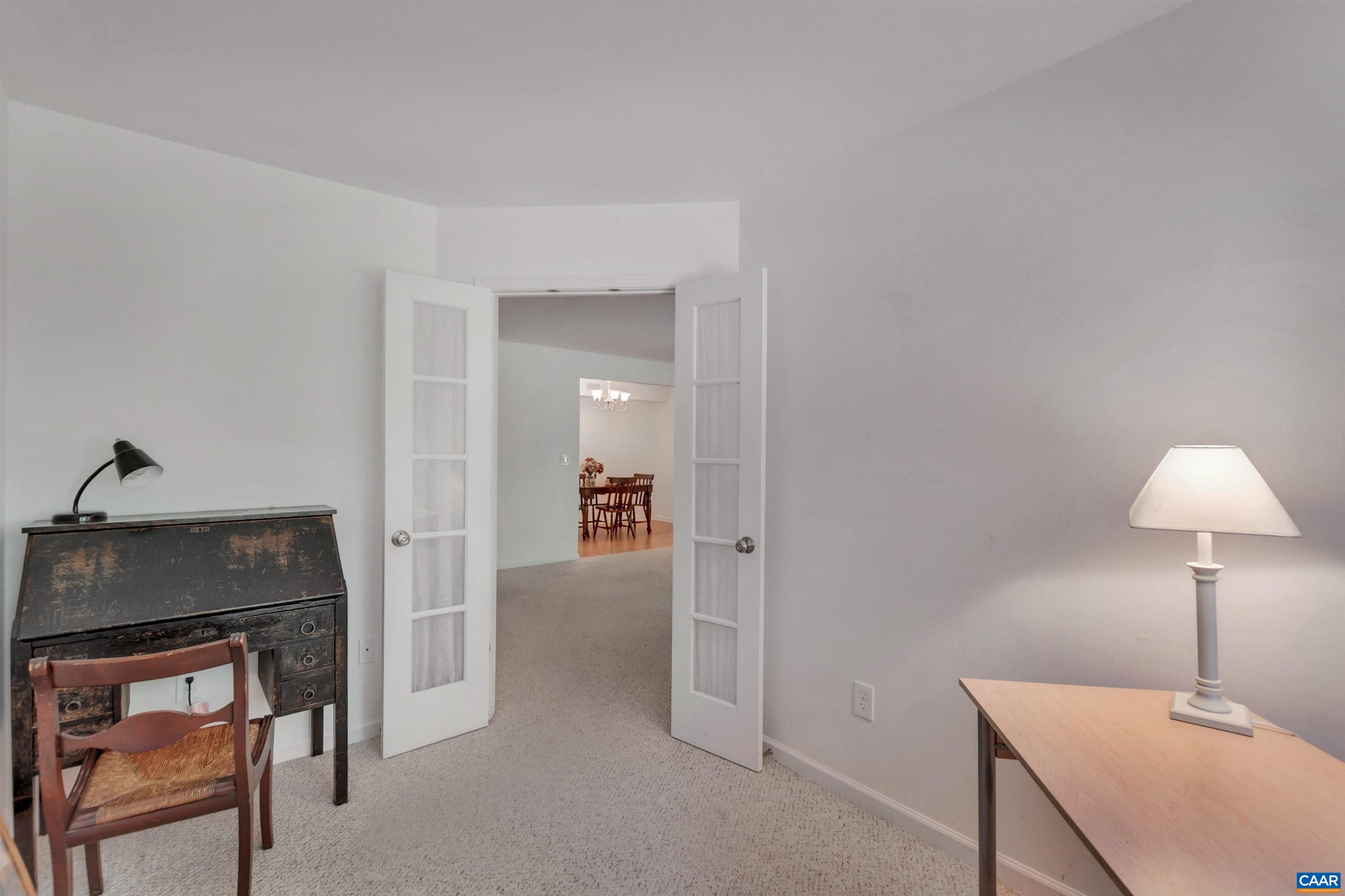 125 Turtle Creek Road, Unit 2 Charlottesville, VA 22901 - Photo 8 of 33 a living room with furniture and a wooden floor
