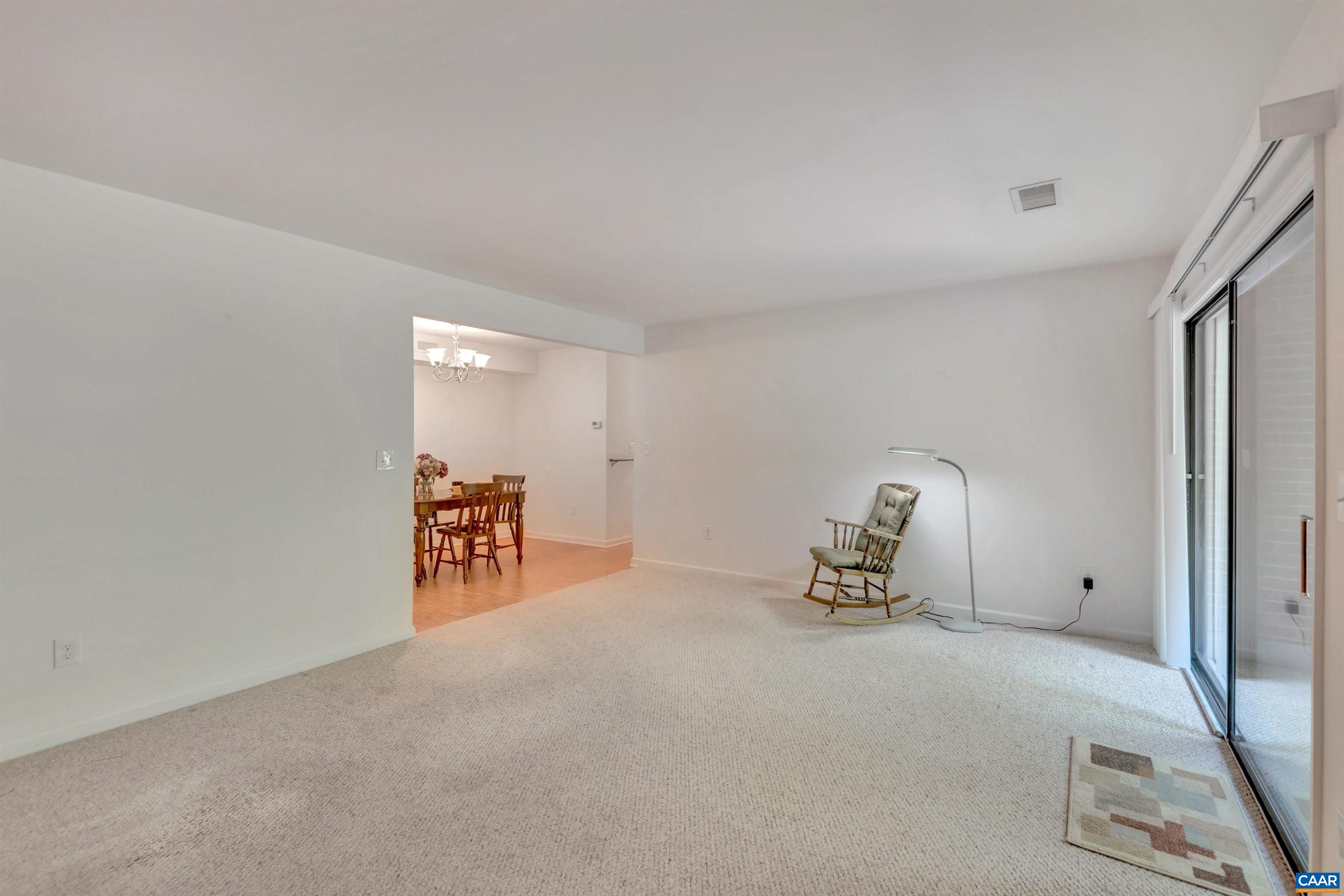 125 Turtle Creek Road, Unit 2 Charlottesville, VA 22901 - Photo 9 of 33 a room with furniture and a table