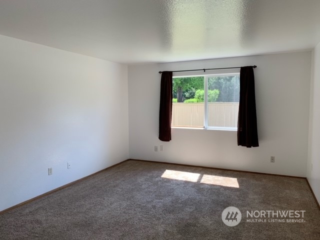 808 Main Street Sultan, WA 98294 - Photo 11 of 13 an empty room with a window