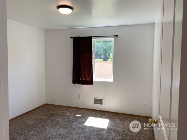 808 Main Street Sultan, WA 98294 - Photo 10 of 13 an empty room with windows