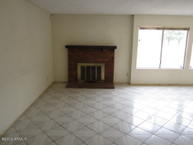 4315 East Vineyard Road Phoenix, AZ 85042 - Photo 22 of 25 Fireplace in Great room