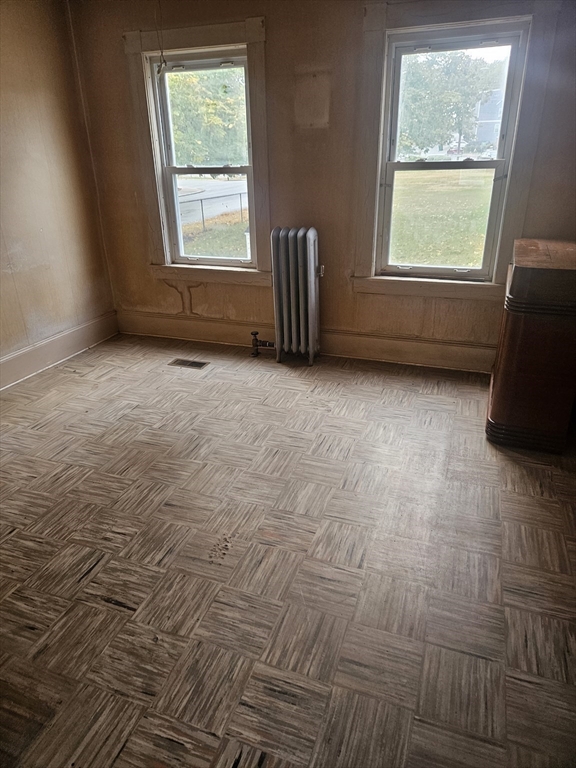 49 Sparks Street Lowell, MA 01854 - Photo 23 of 27 an empty room with a window