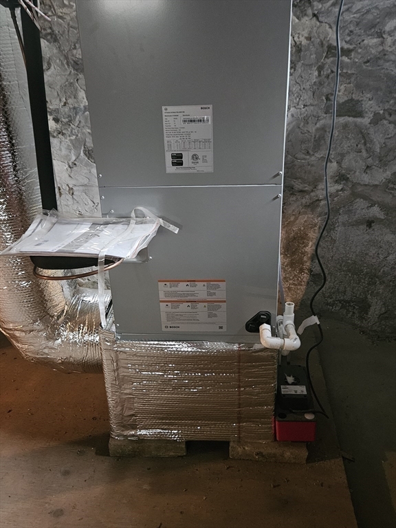 49 Sparks Street Lowell, MA 01854 - Photo 25 of 27 a bathroom with a sink and a mirror