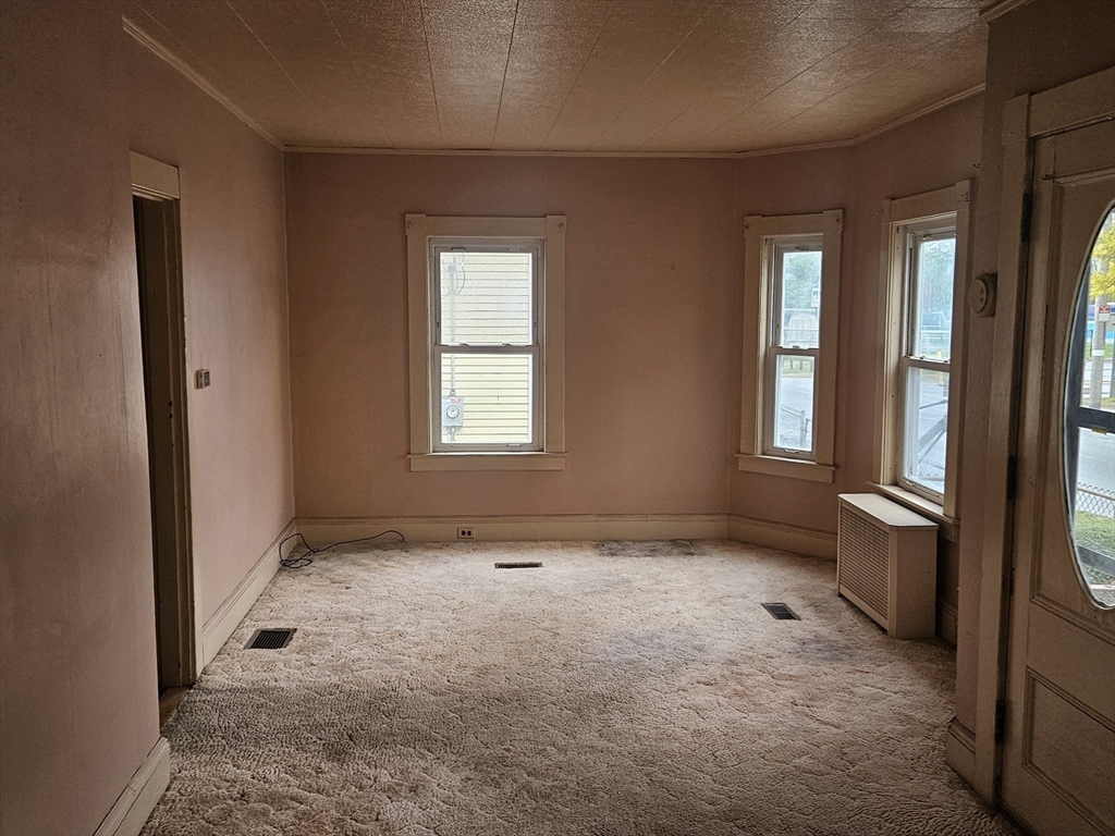 49 Sparks Street Lowell, MA 01854 - Photo 8 of 27 an empty room with windows
