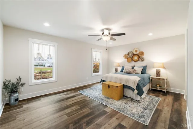 a bathroom with a granite countertop double vanity sink and a mirror
