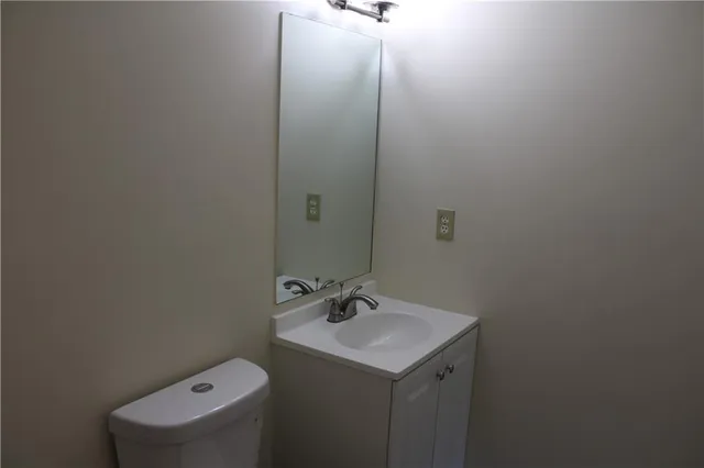 a bathroom with a sink and mirror