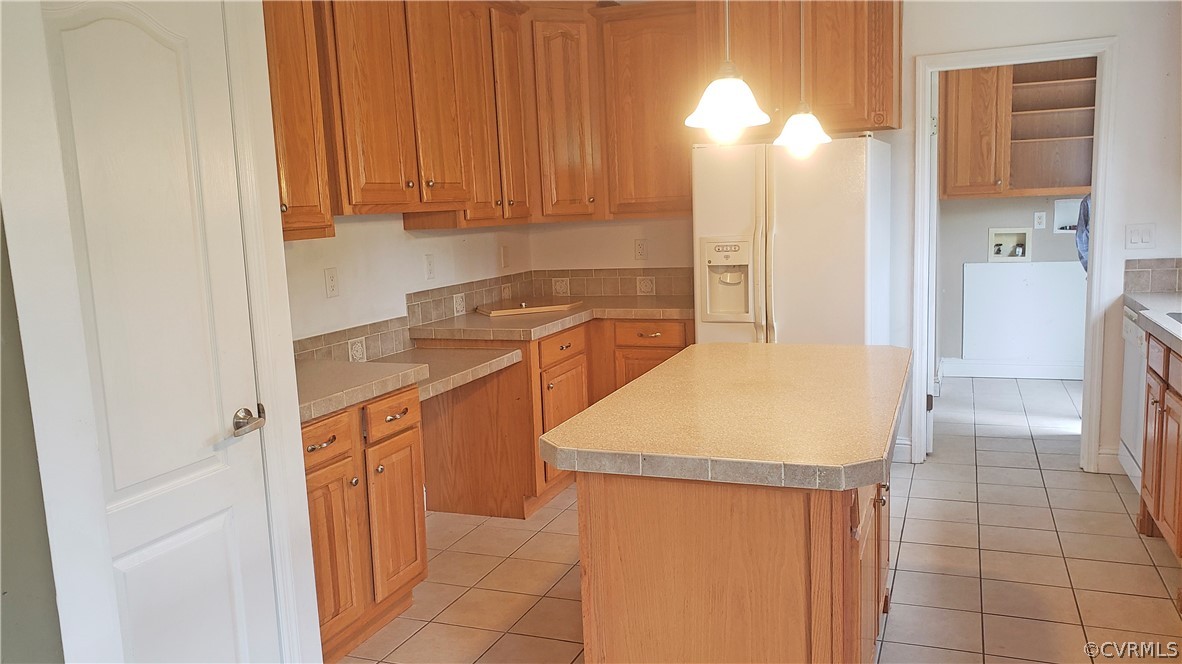 169 Old Sheppards Road Farmville, VA 23901 - Photo 4 of 17 a kitchen with a sink a refrigerator and cabinets
