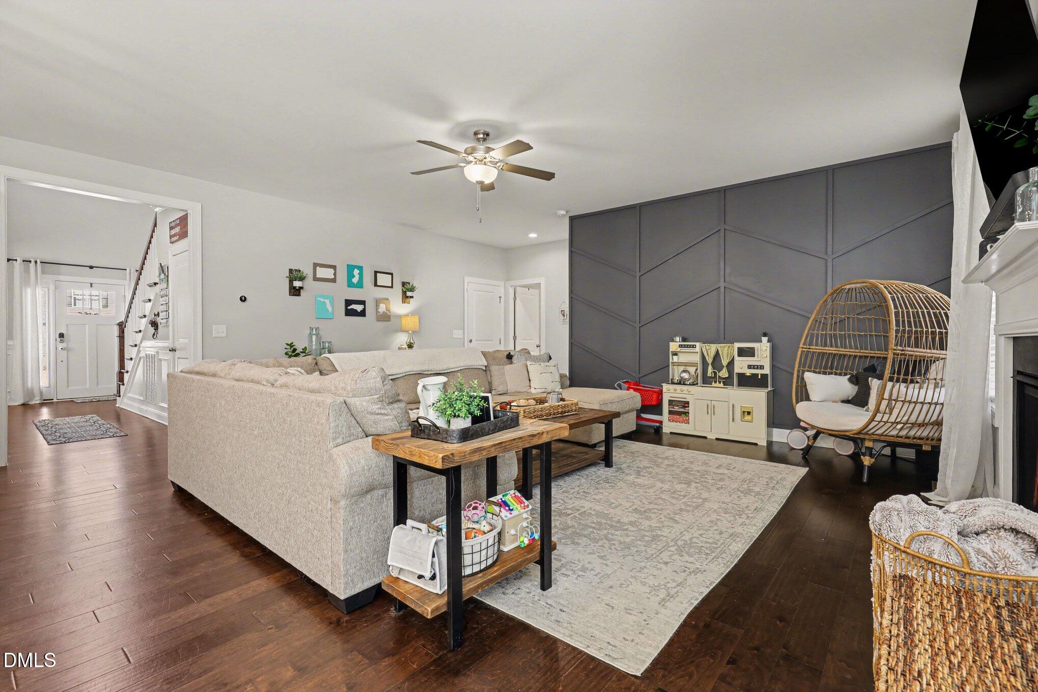 274 Colson Ridge Drive Clayton, NC 27520 - Photo 11 of 48 a living room with furniture and a wooden floor