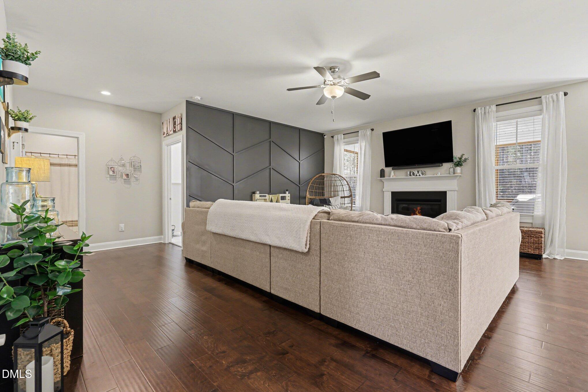 274 Colson Ridge Drive Clayton, NC 27520 - Photo 14 of 48 a living room with furniture and a flat screen tv
