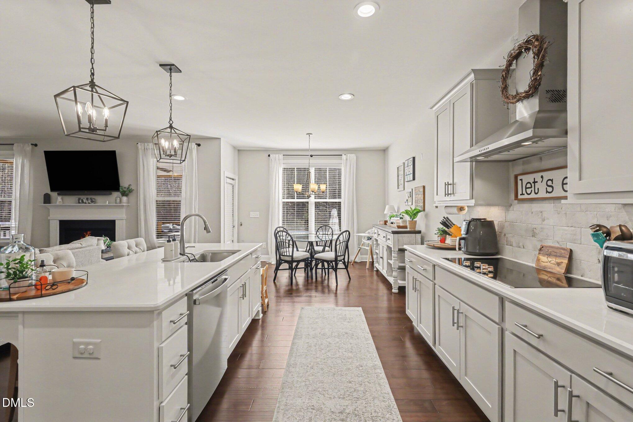 274 Colson Ridge Drive Clayton, NC 27520 - Photo 22 of 48 a kitchen with a sink stove and cabinets