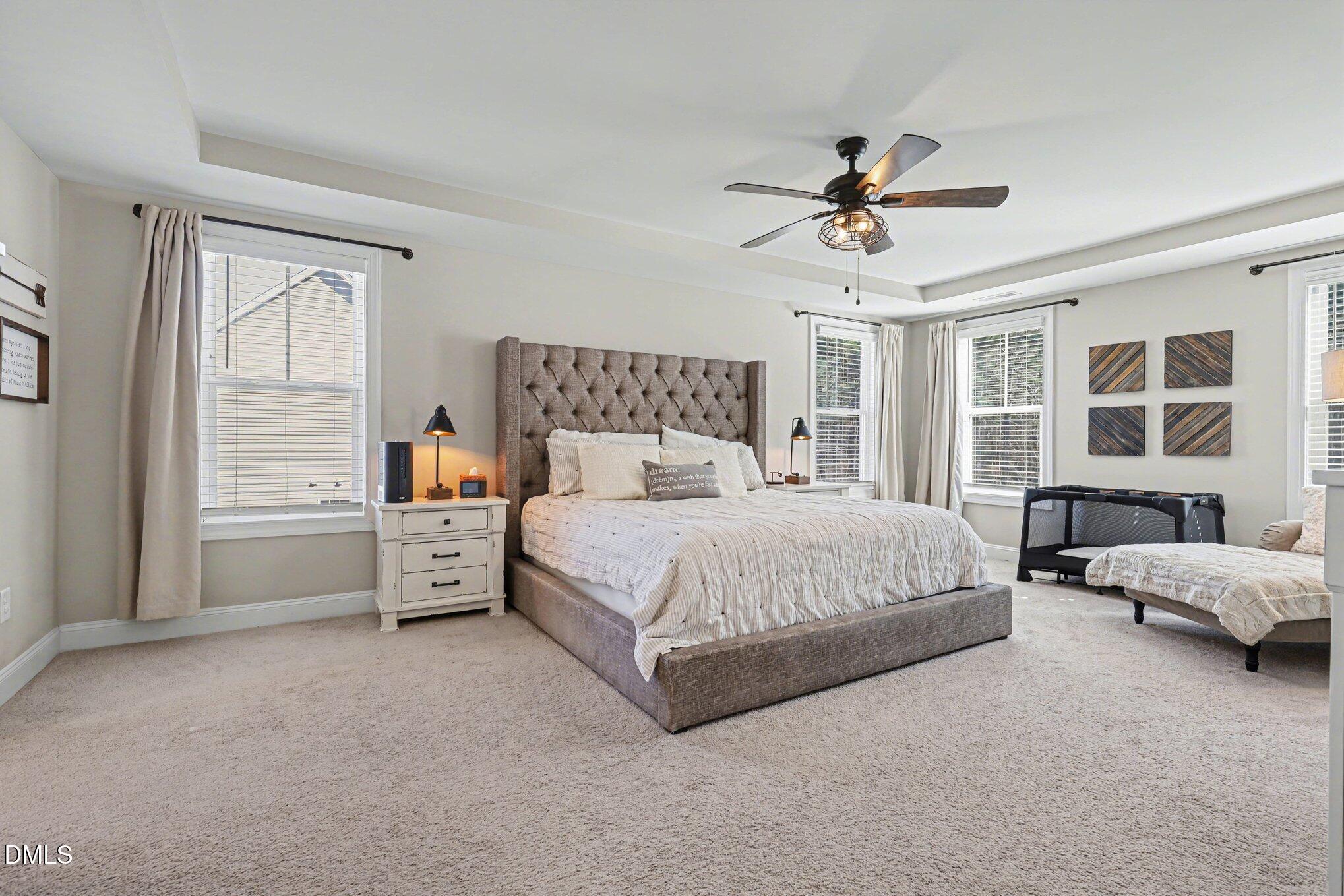 274 Colson Ridge Drive Clayton, NC 27520 - Photo 27 of 48 a bed room with a bed and a window
