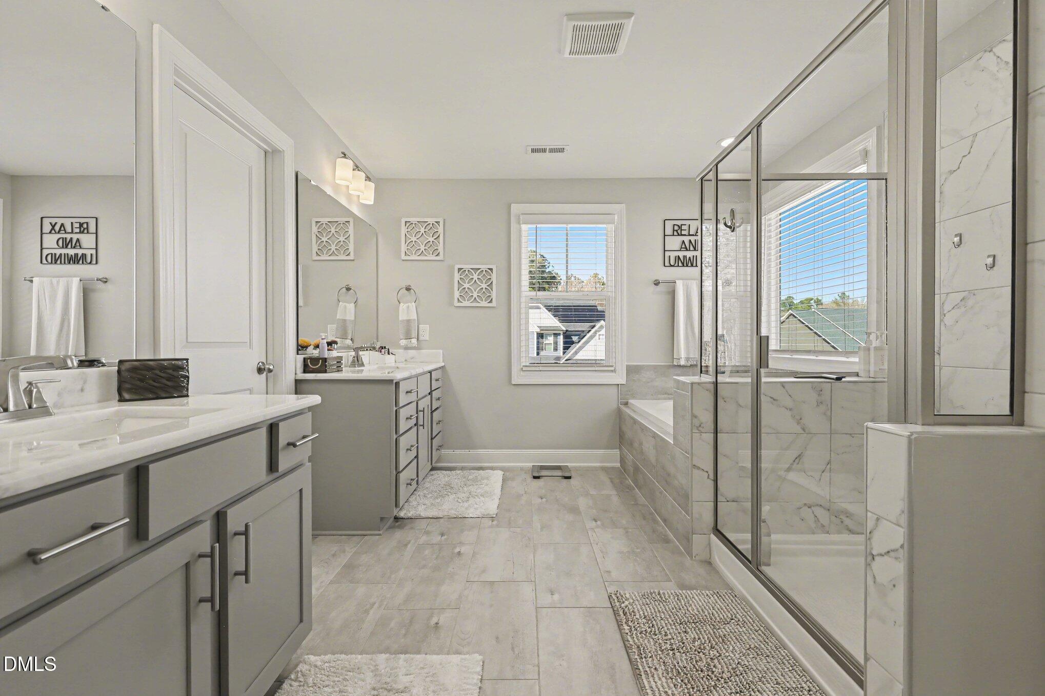 274 Colson Ridge Drive Clayton, NC 27520 - Photo 31 of 48 a bathroom with a double vanity sink toilet and shower