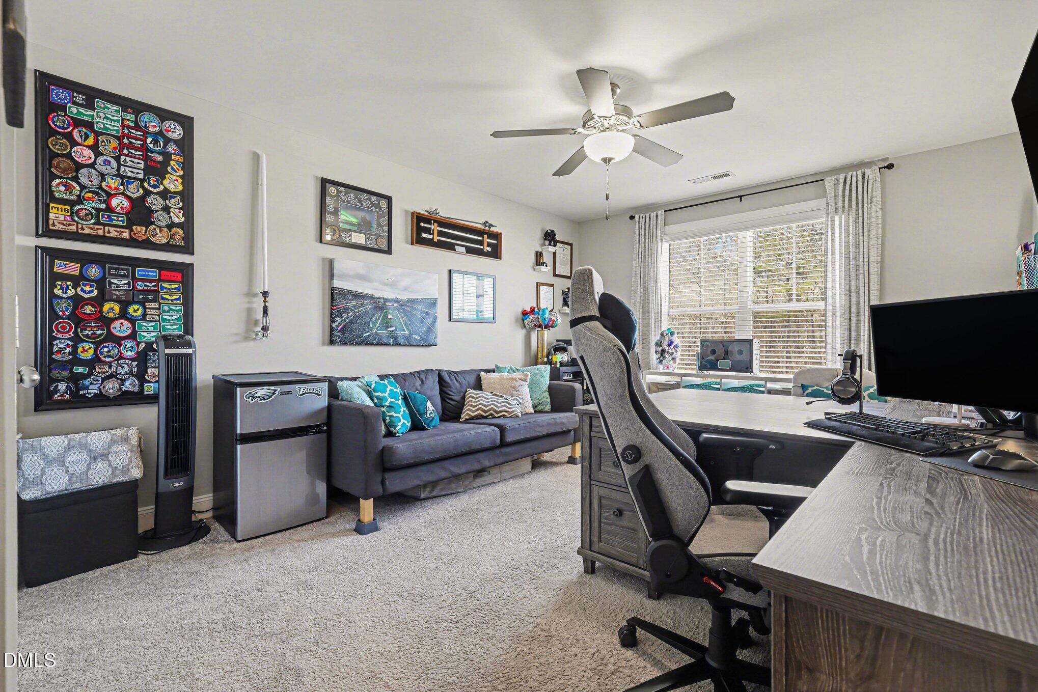 274 Colson Ridge Drive Clayton, NC 27520 - Photo 35 of 48 a view of a livingroom with workspace and a window