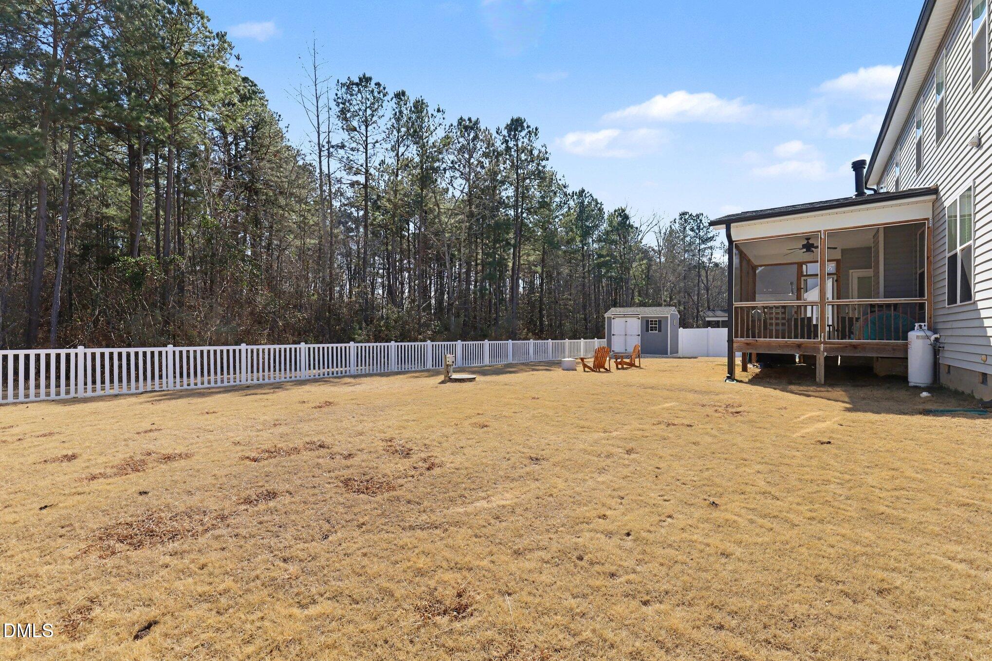 274 Colson Ridge Drive Clayton, NC 27520 - Photo 44 of 48 a swimming pool with wooden fence