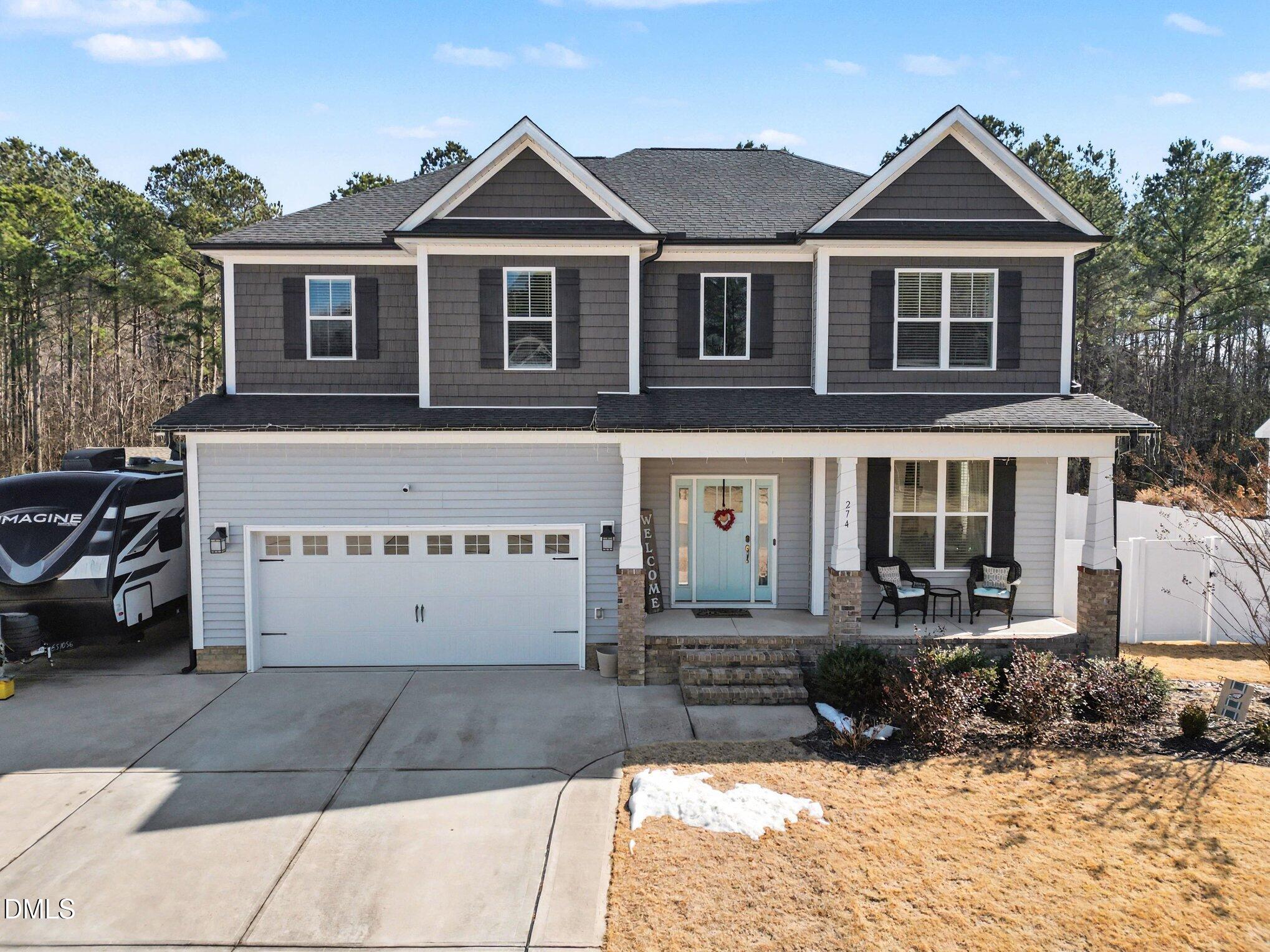 274 Colson Ridge Drive Clayton, NC 27520 - Photo 45 of 48 a front view of a house with a yard