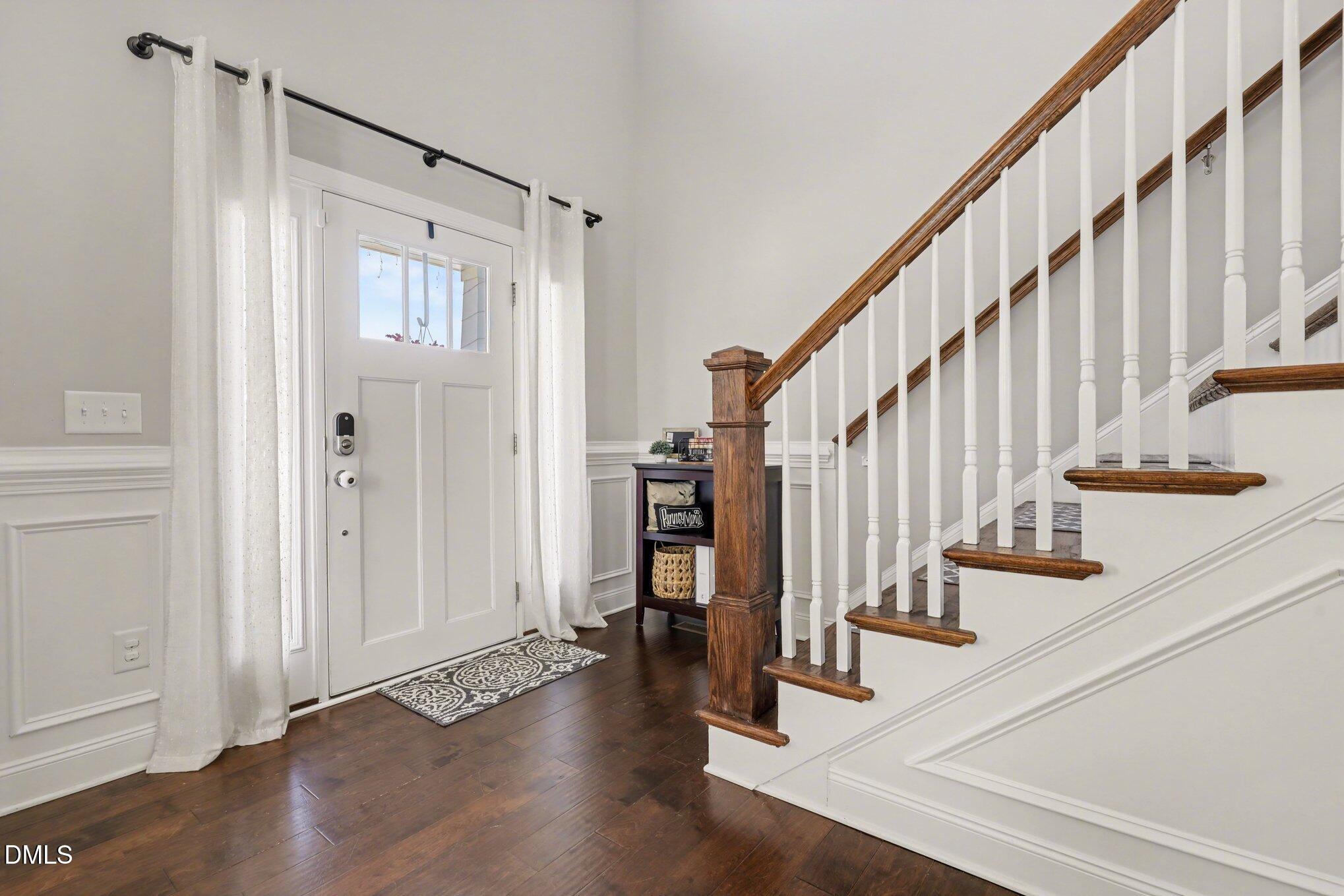 274 Colson Ridge Drive Clayton, NC 27520 - Photo 9 of 48 a view of entryway with wooden floor and stairs