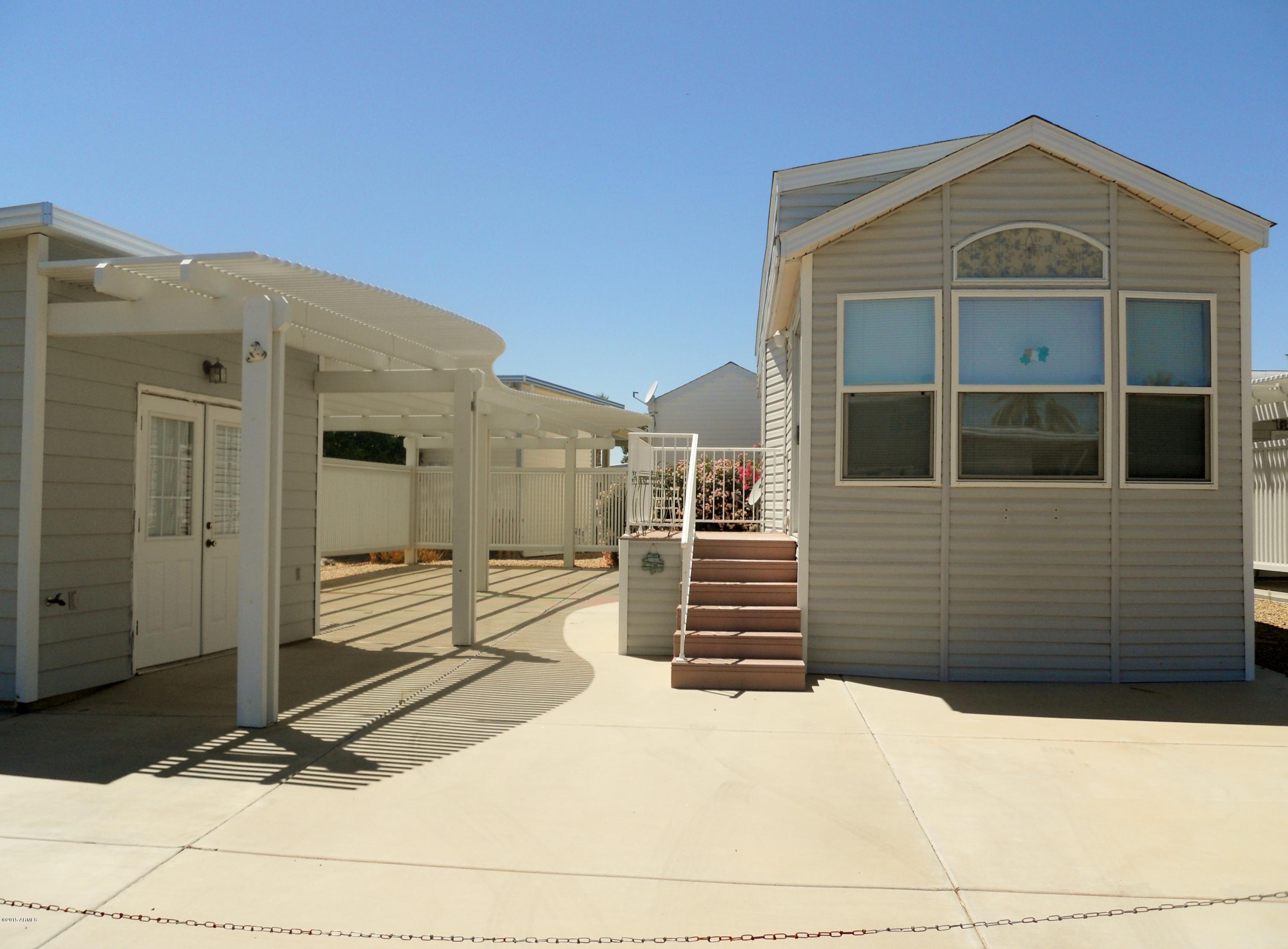 17200 West Bell Road, Unit 798 Surprise, AZ 85374 - Photo 1 of 4 a front view of a house with a yard