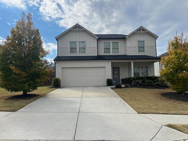 1905 Azure Grove Court Marietta, GA 30008 - Photo 1 of 29 a front view of a house with a yard and garage