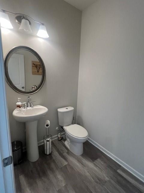 1905 Azure Grove Court Marietta, GA 30008 - Photo 9 of 29 a bathroom with a toilet sink and mirror