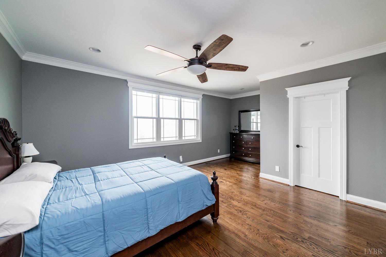 967 Lynbrook Road Rustburg, VA 24588 - Photo 51 of 99 a bedroom with a bed and wooden floor